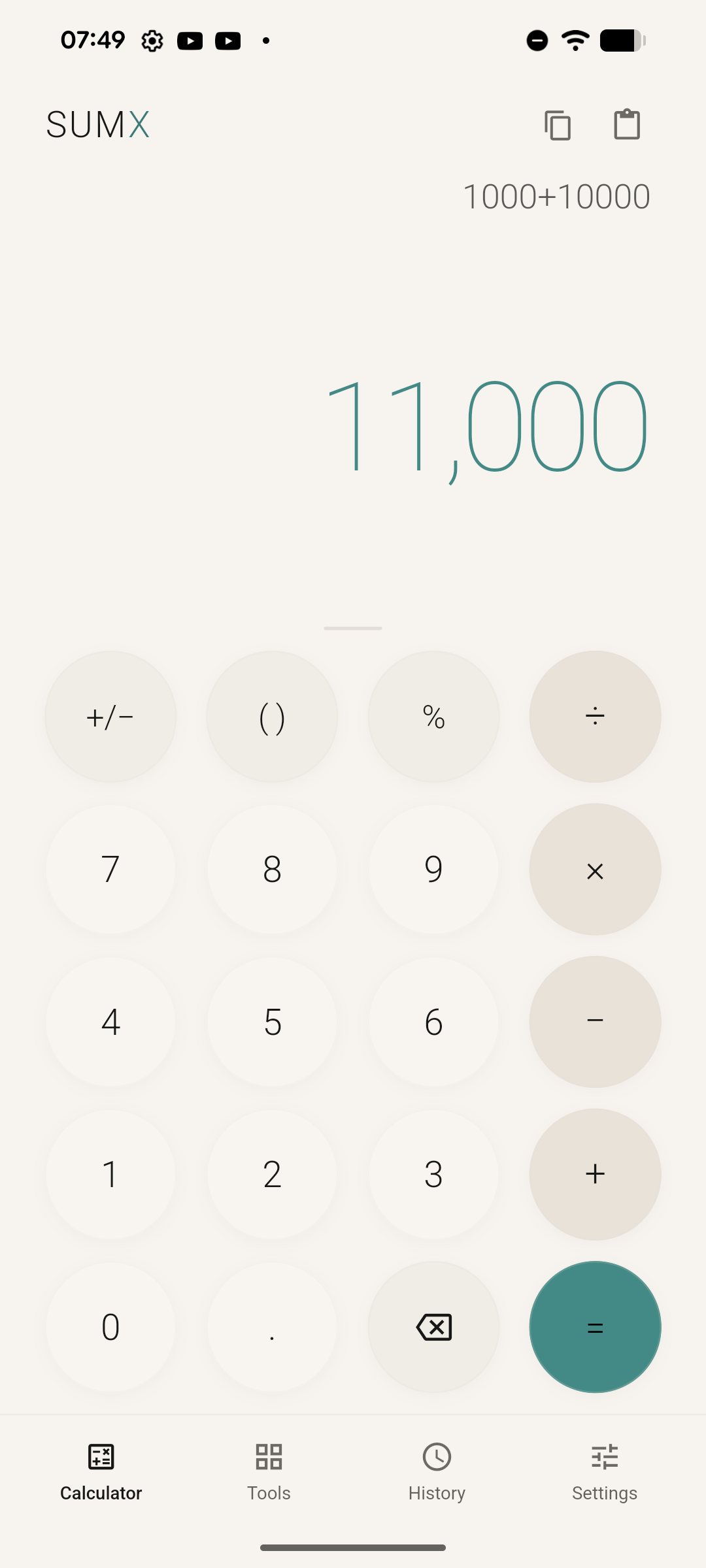 The same SUMX calculator in light theme, with the entry 1000+10000, the result 11,000 in teal, and a keypad of pale round keys.